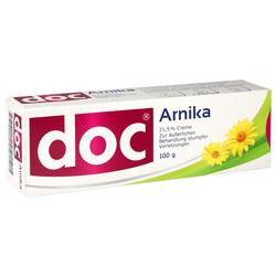 Eine Schachtel mit Arnika-Creme gegen Verletzungen zeigt gelbe Blüten.